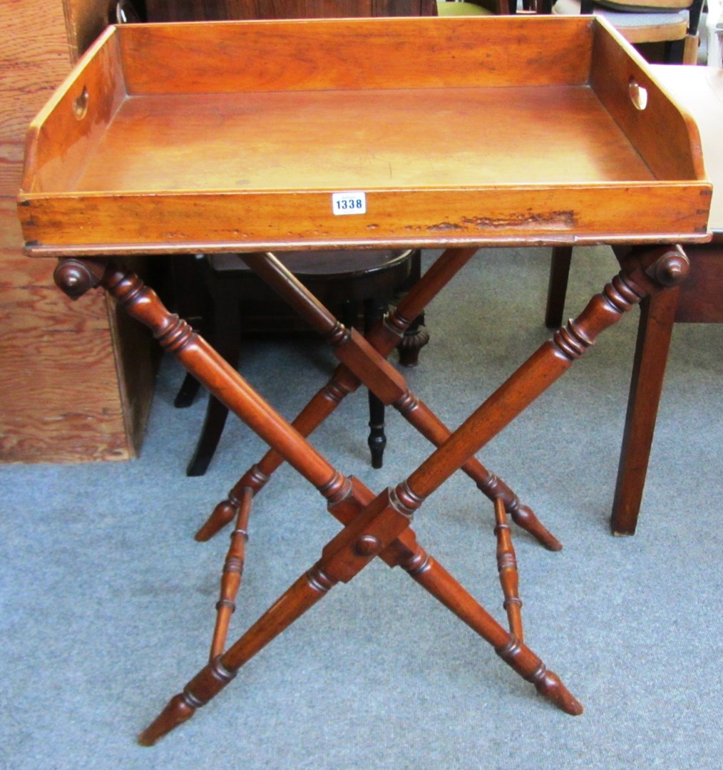 Appraisal: A George III rectangular mahogany butlers tray on folding turned