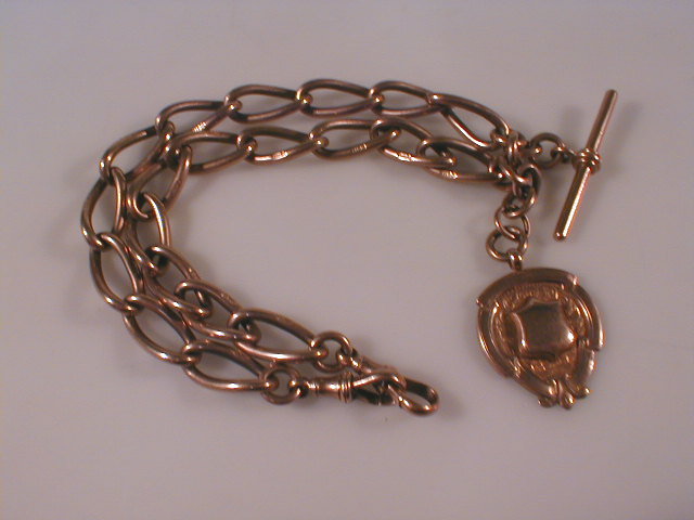 Appraisal: A large curb open link watch chain with attached fob