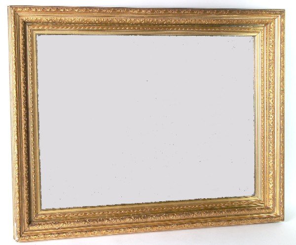 Appraisal: Ornate gold leafed gesso frame with new beveled glass mirror