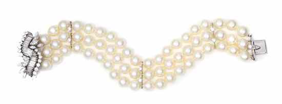 Appraisal: A Platinum Cultured Pearl and Diamond Triple Strand Bracelet containing