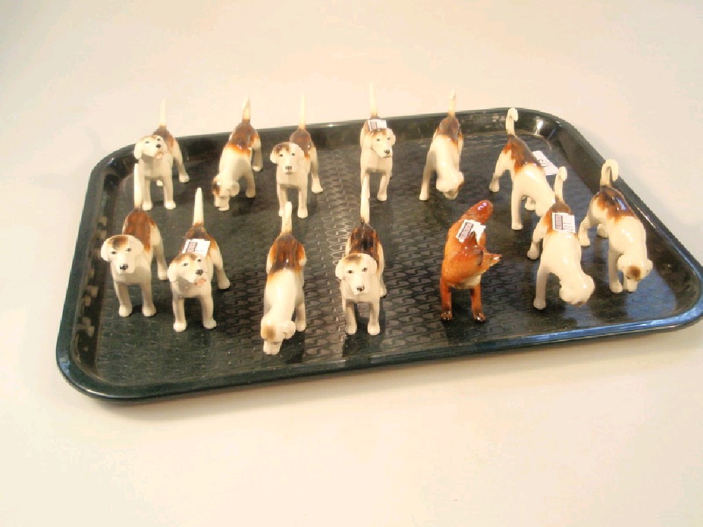 Appraisal: Beswick twelve foxhounds six tail up six tail down and