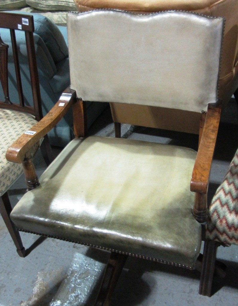 Appraisal: A th century leather upholstered oak framed office swivel chair