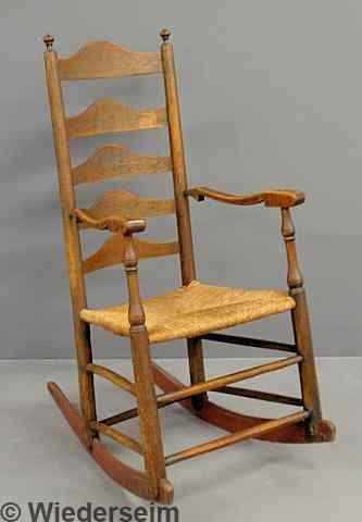 Appraisal: Pennsylvania maple five-slat rocker c with a rush seat h