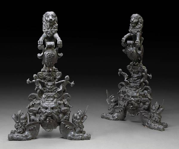 Appraisal: A pair of Baroque style bronze andirons Each surmounted by