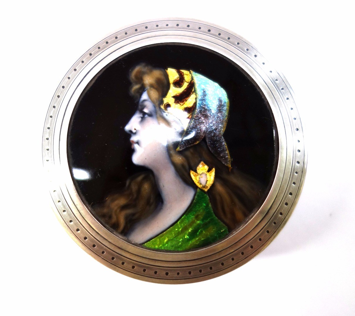 Appraisal: A Limoges style enamel and silver circular patchbox and cover