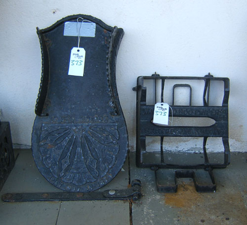 Appraisal: Cast iron boot scrape by Walrond together with another late