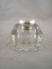 Appraisal: A cut glass base inkwell with silver mounts lid AF