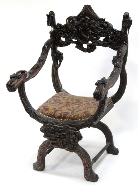 Appraisal: A carved Eastern open armchair the crest rail of pagoda