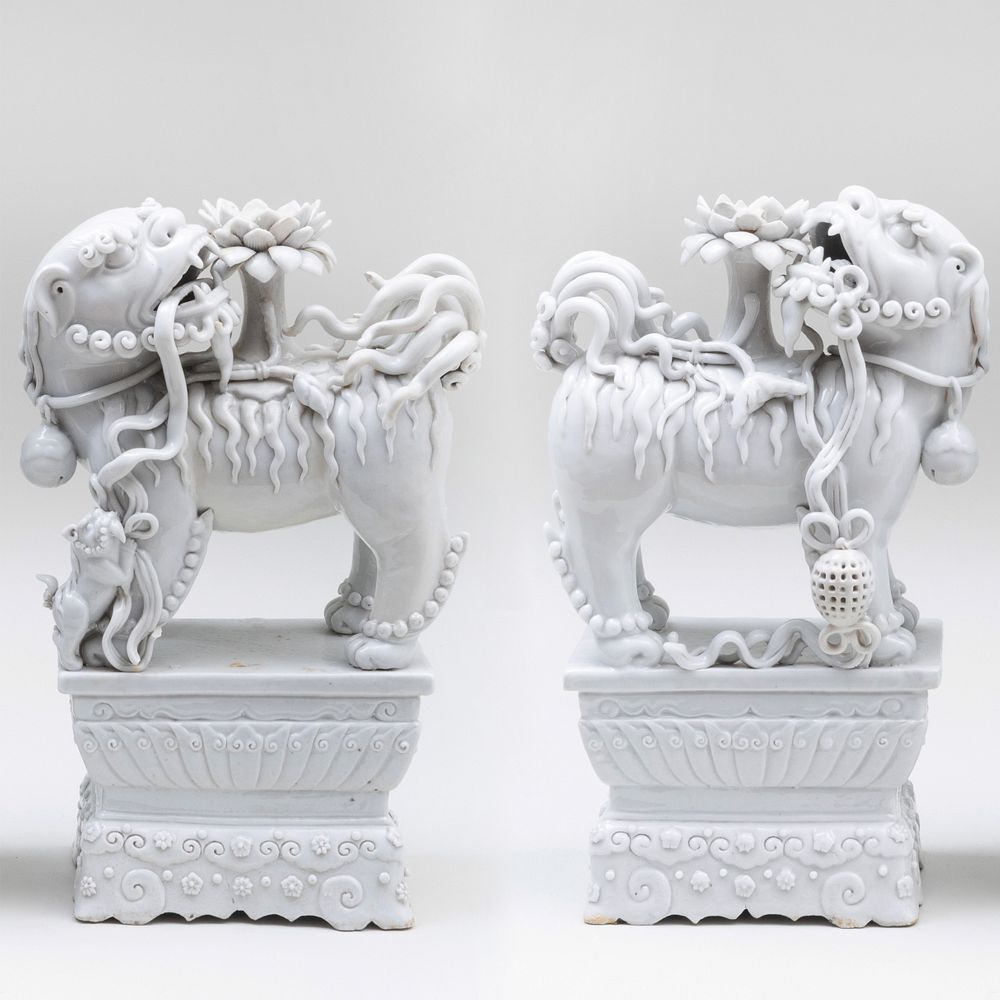 Appraisal: Pair of Chinese White Glazed Porcelain Buddhistic Lion Candle Holders