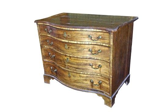 Appraisal: A late th Century mahogany serpentine front chest the top