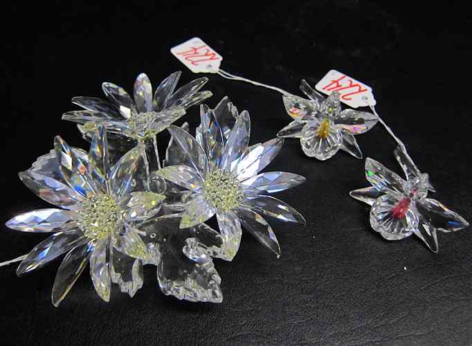 Appraisal: THREE SWAROVSKI CUT CRYSTALS ''Maxxi Flower Arrangement '' together with