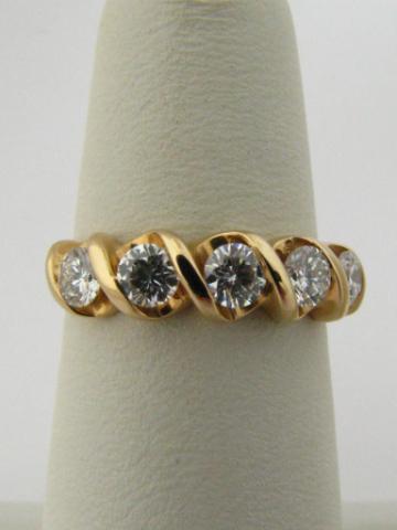 Appraisal: k yellow gold diamond anniversary ring containing approx ct ctw