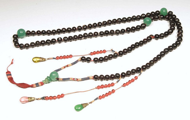 Appraisal: A LONG MANDARIN BEAD NECKLACE with jade inset beads and