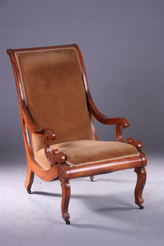 Appraisal: AMERICAN EASTLAKE CARVED OAK OPEN ARMCHAIR Circa back-scrolled high padded