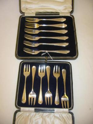 Appraisal: A SET OF SIX CAKE FORKS the shaped handle moulded