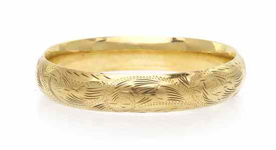 Appraisal: A Karat Yellow Gold Hinged Bangle Bracelet with foliate design