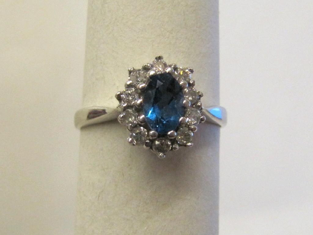 Appraisal: Nine carat white gold aquamarine and diamond cluster ring