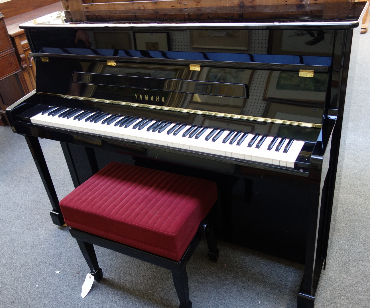 Appraisal: A th century Yamaha overstrung iron framed upright piano with