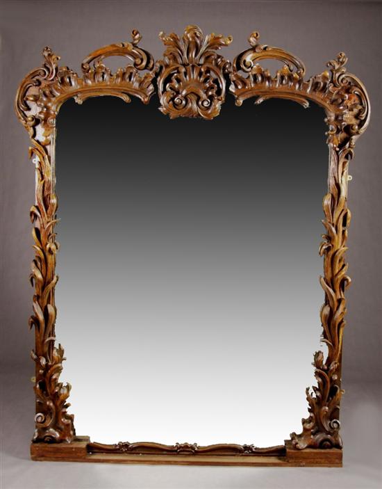 Appraisal: CHIPPENDALE STYLE OVERMANTLE MIRROR th century mixed woods Scrolling-foliate crest