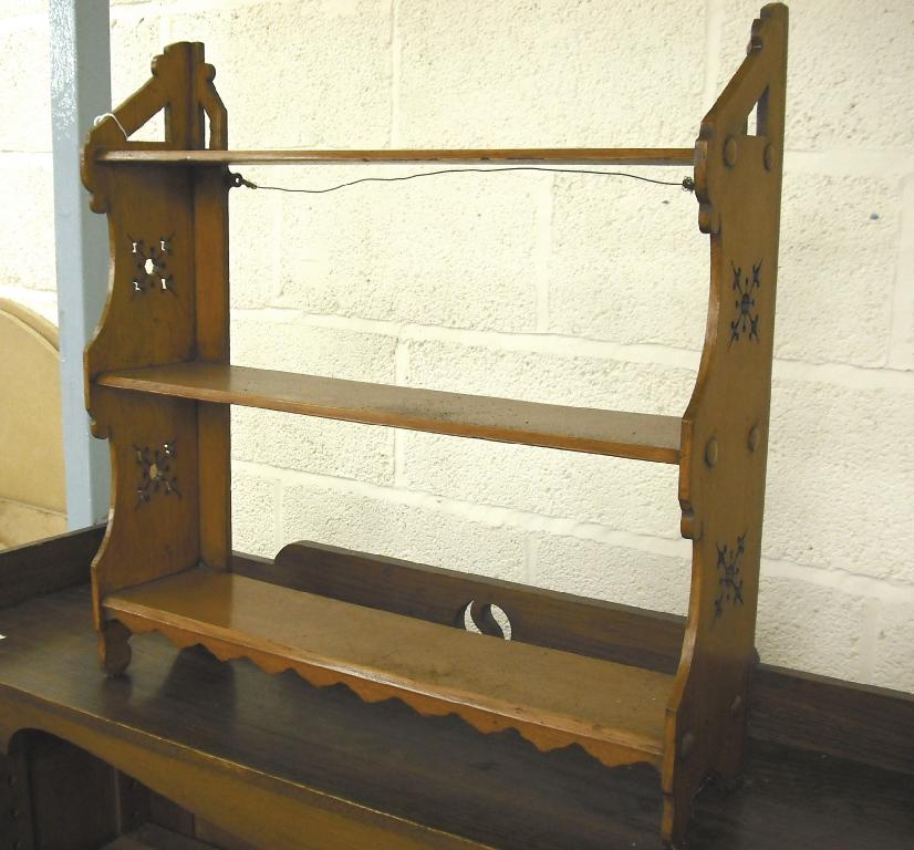 Appraisal: Late th century aesthetic oak three tier wall shelf with