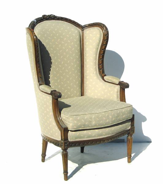 Appraisal: A Louis XVI style walnut bergere th century height in