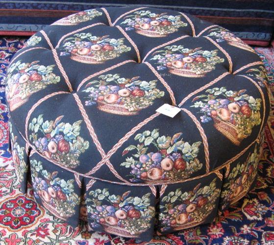 Appraisal: A LARGE ROUND OTTOMAN with overall buttoned tapestry cover and