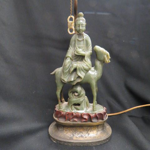 Appraisal: Chinese Carved Jade Lamp immortal riding a goat figure is