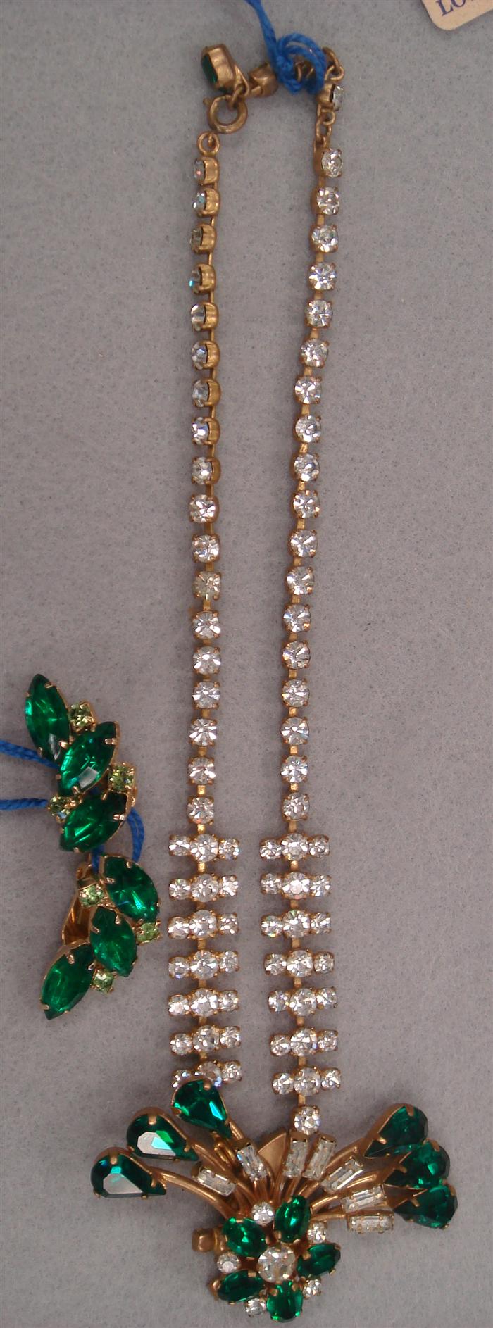 Appraisal: Vintage rhinestone necklace featuring emerald colored stone with earrings Estimate