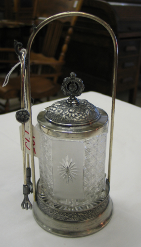 Appraisal: AN AMERICAN MERIDEN SILVERPLATED PICKLE CASTOR AND TONGS The stand