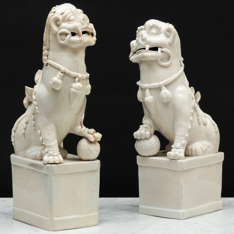 Appraisal: Two Blanc de Chine Porcelain Buddhist Lions Joss Stick Holders