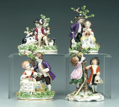 Appraisal: Four German porcelain figurines seated boy with goats seated girl