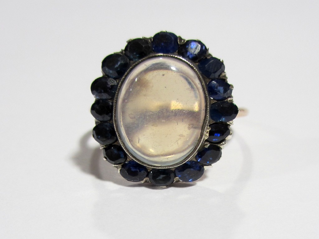 Appraisal: An attractive Edwardian moonstone and sapphire ring the large oval