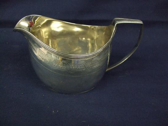 Appraisal: Georgian III silver cream jug with chased decoration London oz