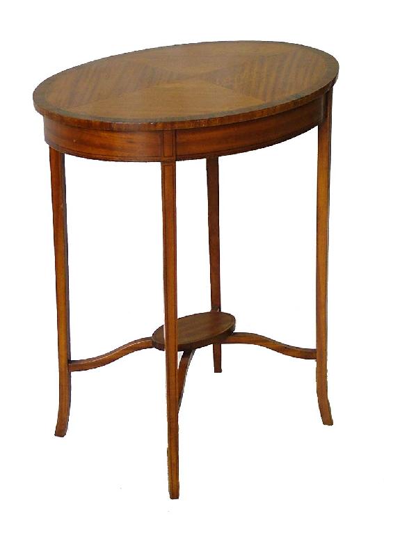 Appraisal: Edwardian satin wood oval two tier occasional table the quarter