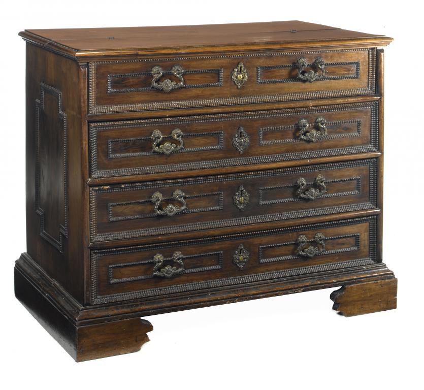 Appraisal: A NORTH ITALIAN WALNUT CHEST OF DRAWERS the half hinged