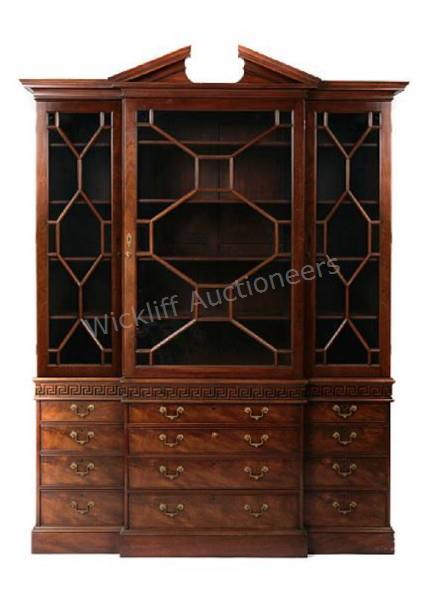 Appraisal: A solid mahogany and mahogany veneer breakfront china cabinet by