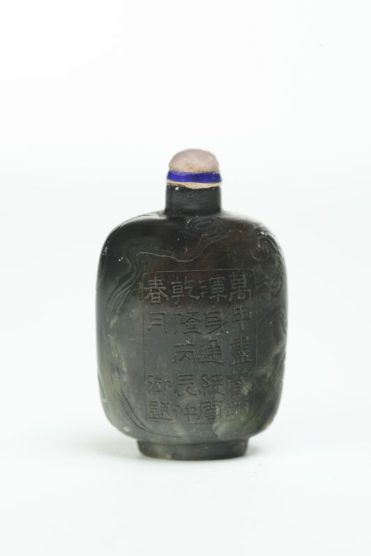 Appraisal: SNUFF BOTTLE China reputedly a green and black jade snuff