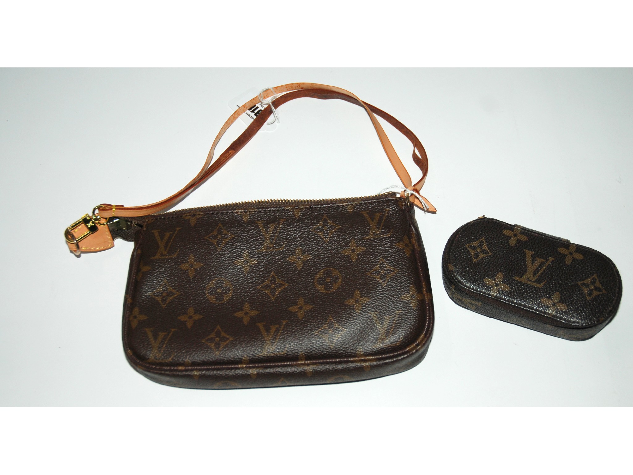 Appraisal: A brown leather hand bag stamped Louis Vuitton and a