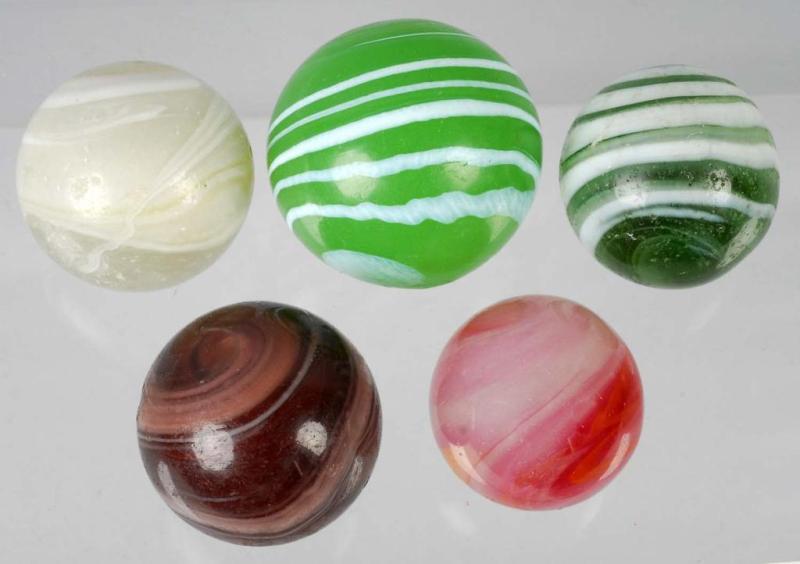 Appraisal: Lot of Marbles Description Includes four latent transitional marbles and