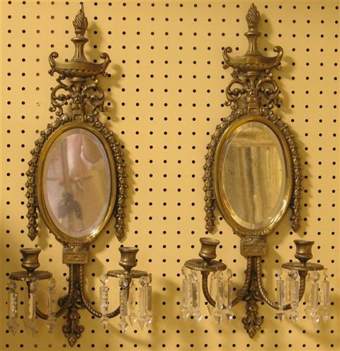 Appraisal: PAIR OF NEOCLASSICAL BRASS SCONCES Cast with an urn hung