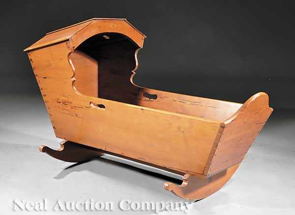 Appraisal: An Antique American Cherrywood Cradle early th c dovetailed hood