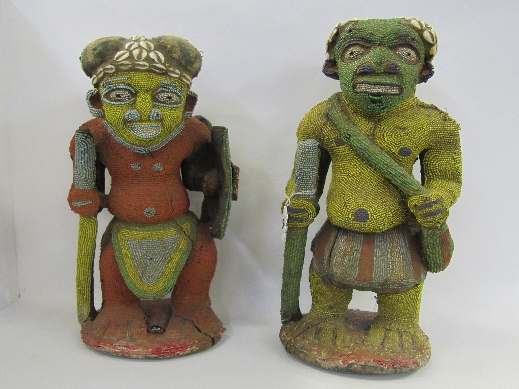 Appraisal: Two African figures with bead and shell decoration