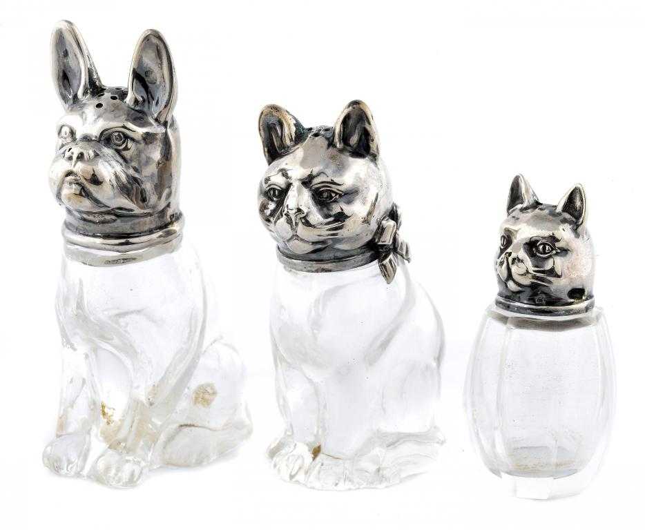 Appraisal: THREE CONTINENTAL NOVELTY SILVER-MOUNTED CAT AND DOG PEPPER CASTERS -