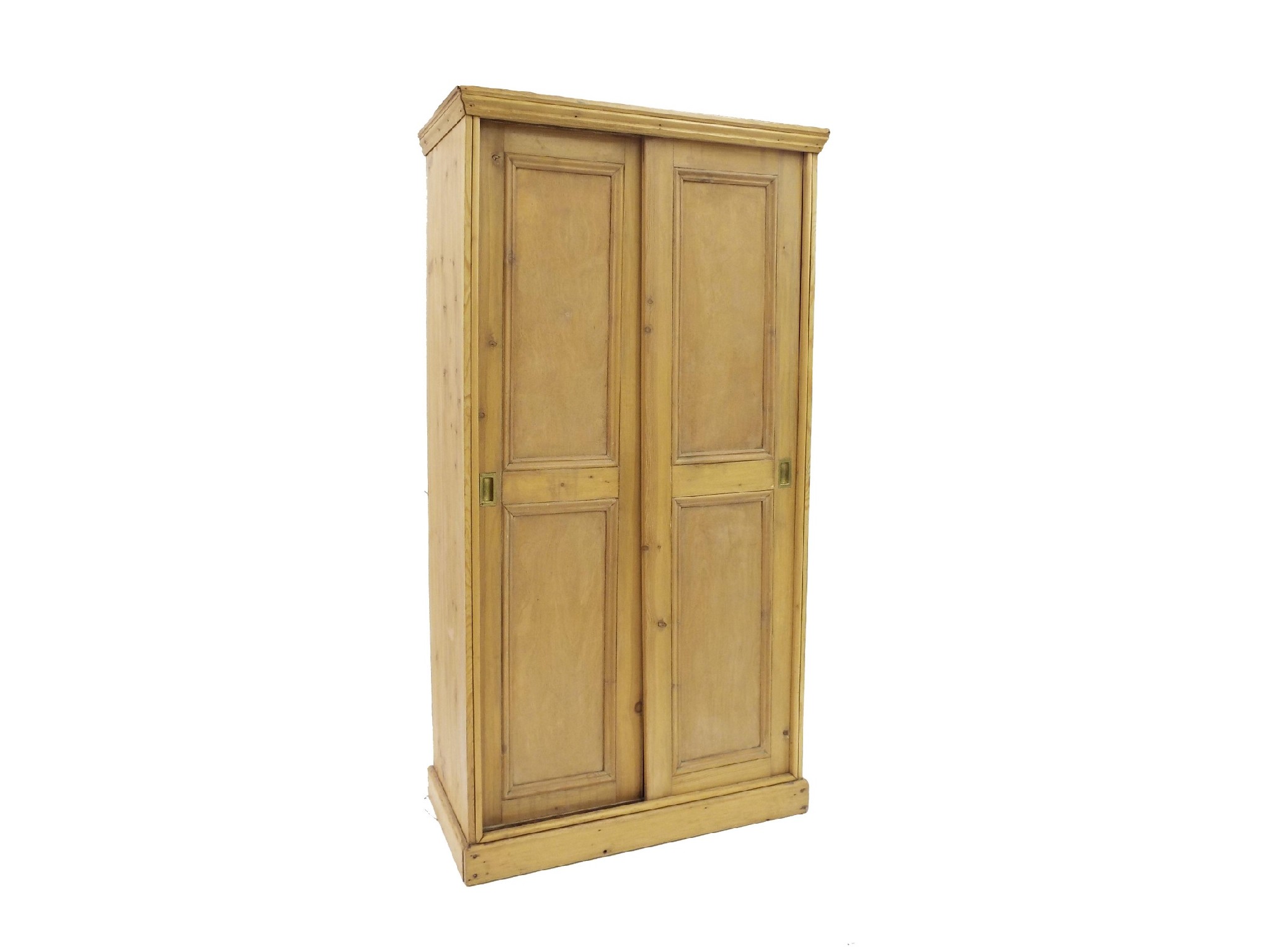 Appraisal: Reclaimed stripped waxed pine wardrobe cupboard with sliding doors enclosing