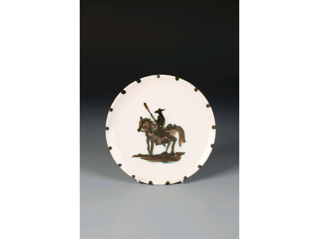 Appraisal: PABLO PICASSO AN EARTHENWARE PLATE decorated with a figure on