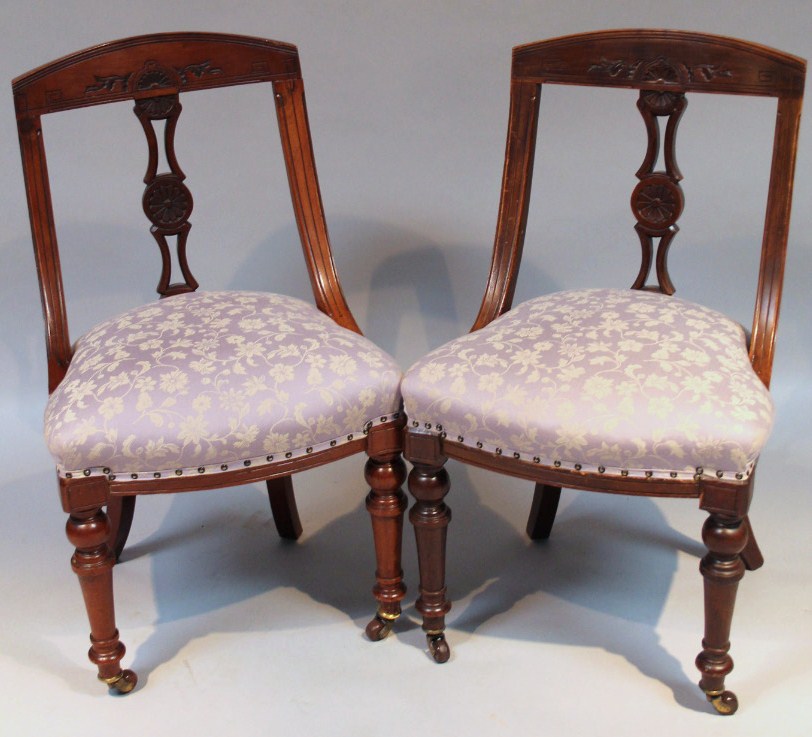 Appraisal: A pair of Edwardian stained walnut dining chairs each shaped