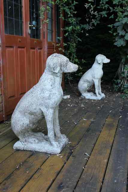 Appraisal: A PAIR OF RECONSTITUTED STONE LABRADORS sitting up to attention