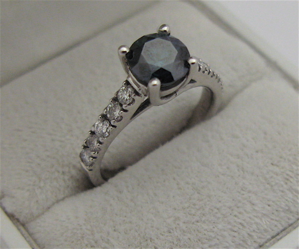 Appraisal: BLUE DIAMOND AND KARAT WHITE GOLD RING with appraisal Centered