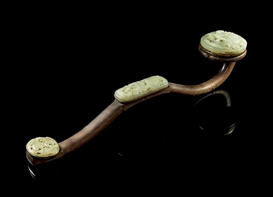 Appraisal: A Jade Mounted Wood Ruyi Scepter Length inches A Jade