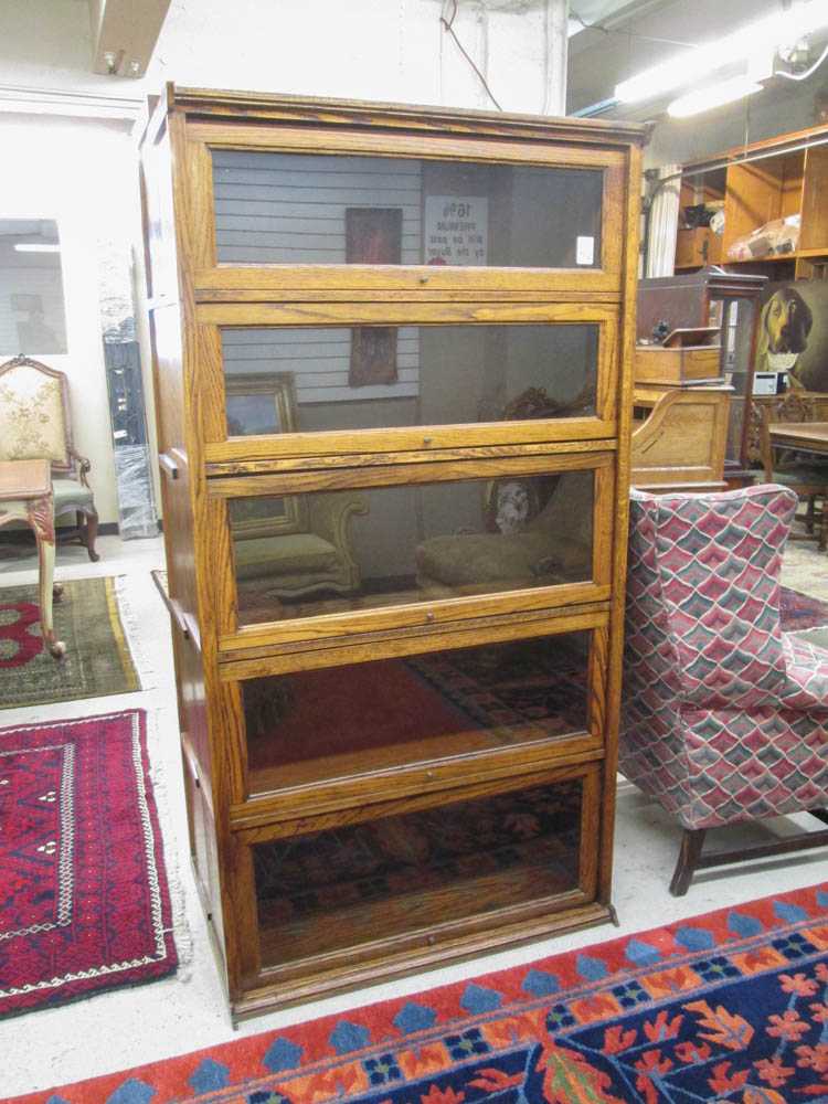 Appraisal: A 'STACKING' OAK BOOKCASE antique reproduction having five horizontal sections